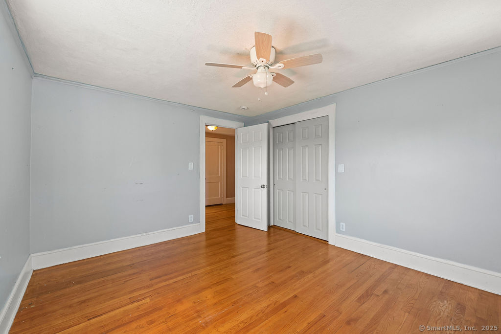 105 School Road Bolton, CT 06043 - Photo 23 of 39 a view of an empty room and wooden floor