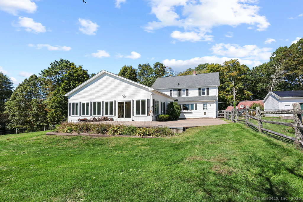 105 School Road Bolton, CT 06043 - Photo 29 of 39 a front view of a house with garden