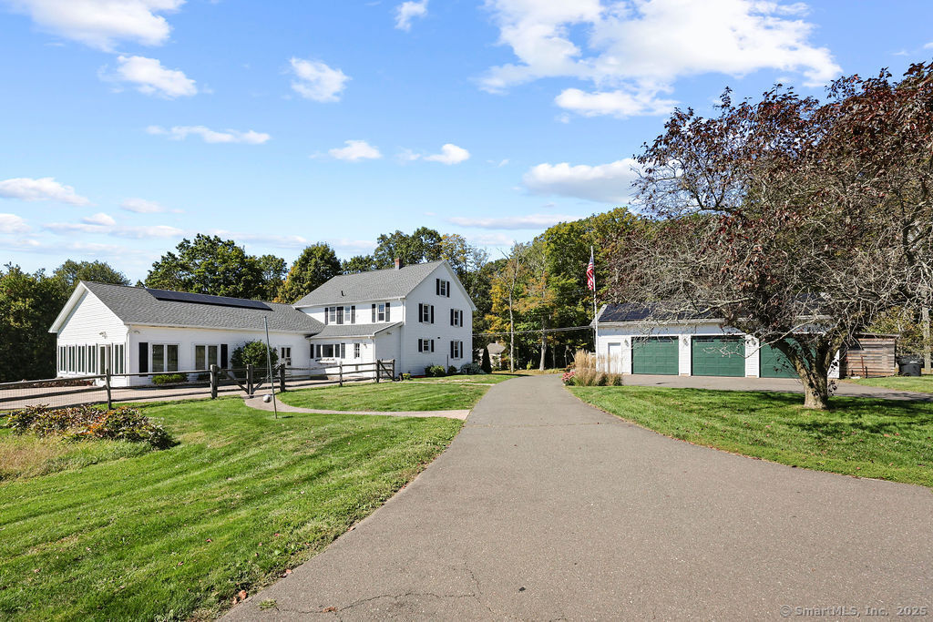 105 School Road Bolton, CT 06043 - Photo 31 of 39 front view of a house with a yard