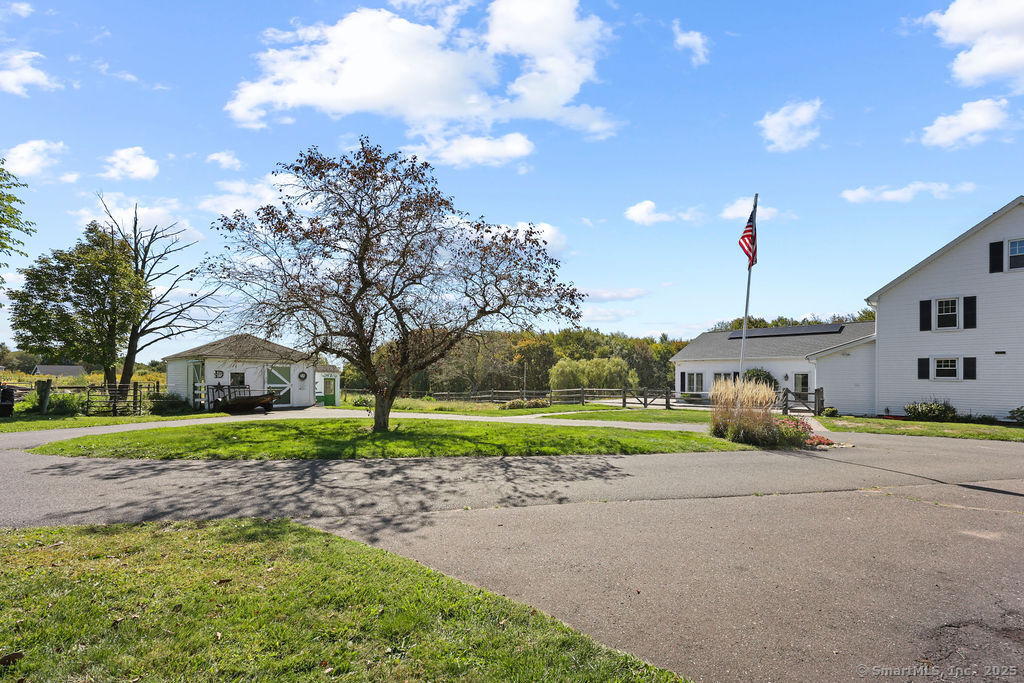 105 School Road Bolton, CT 06043 - Photo 33 of 39 a view of a house with a yard and entertaining space
