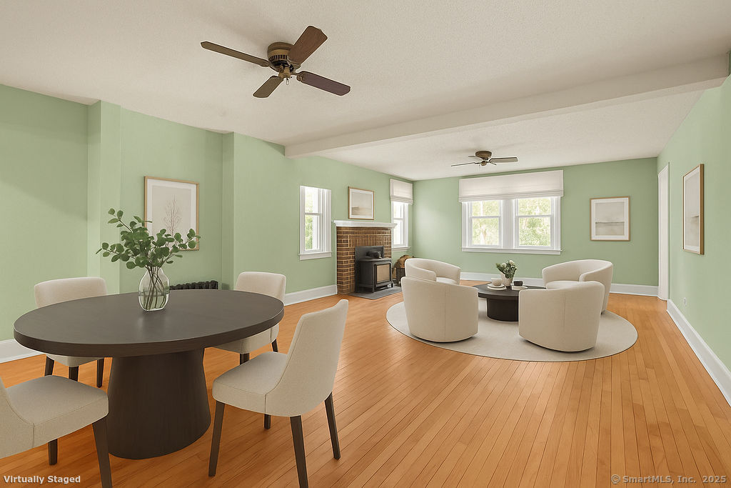 105 School Road Bolton, CT 06043 - Photo 5 of 39 a dining room with wooden floor and a chandelier