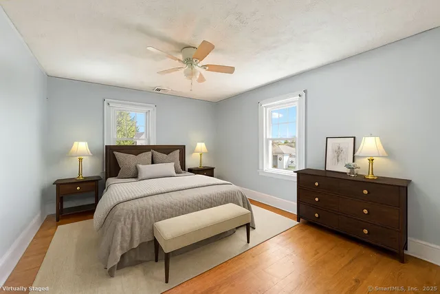 a bedroom with a bed and window