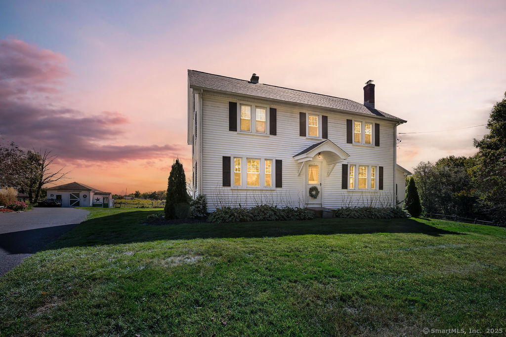 105 School Road Bolton, CT 06043 - Photo 9 of 39 a front view of a house with a yard