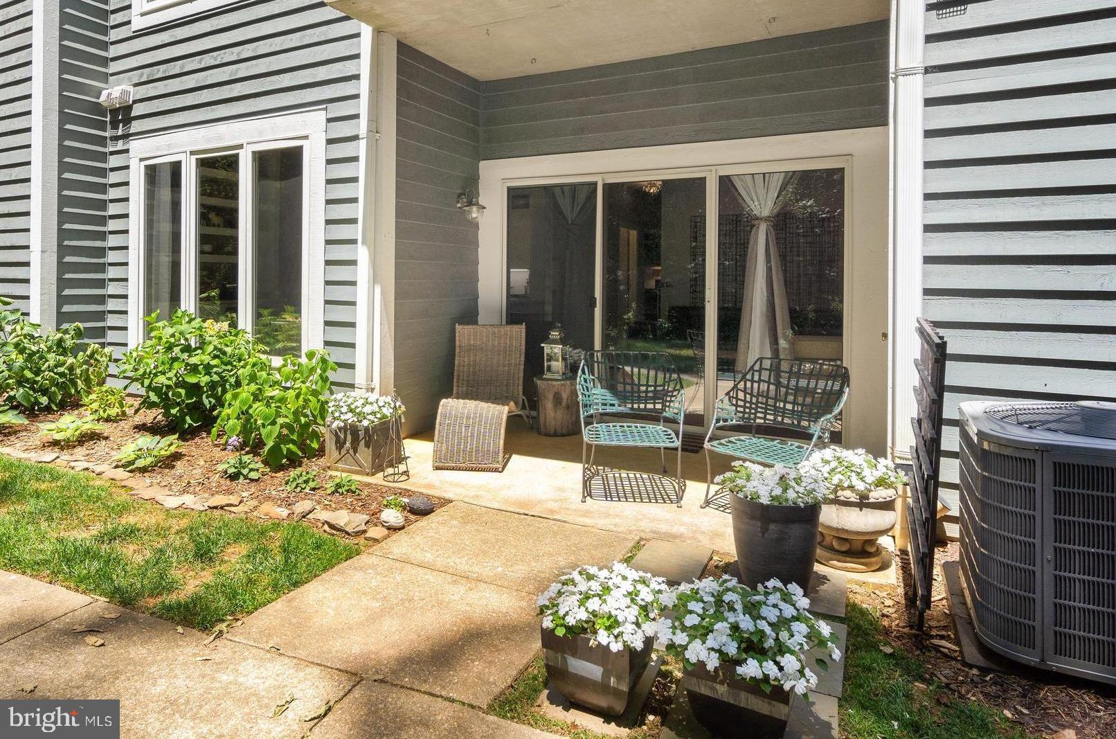 645 Oakland Hills Drive, Unit 1B Arnold, MD 21012 - Photo 3 of 30 Ground level rear patio backing to woods & golf