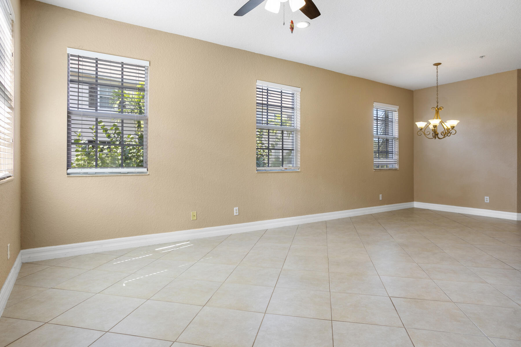 114 Locustberry Lane, Unit 101 Jupiter, FL 33458 - Photo 26 of 59 a view of an empty room with a window