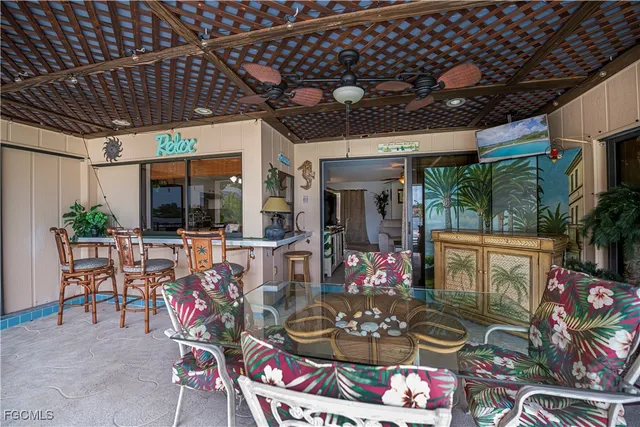 a bedroom with a bed and glass flat screen tv