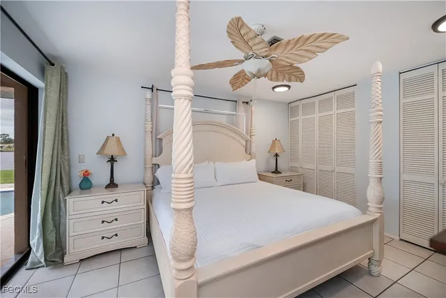 a view of a hallway with closet and bathroom