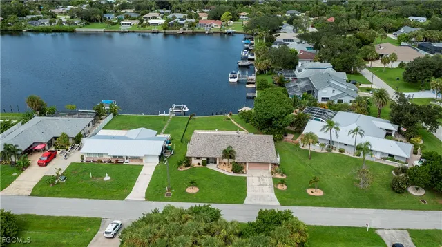 an aerial view of a house with a garden and trees