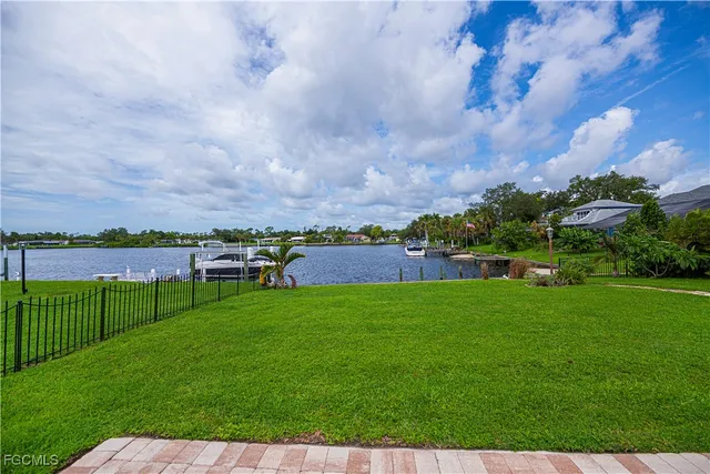 a view of a garden with a building in the background