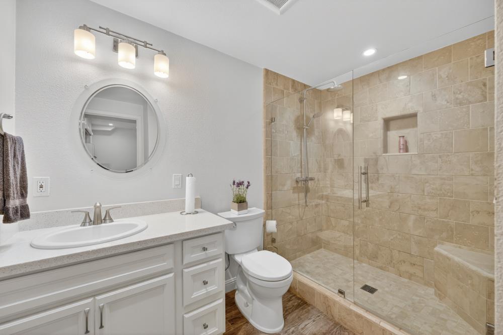 3340 Garden Bar Road Lincoln, CA 95648 - Photo 40 of 56 a bathroom with a toilet a sink a shower and a mirror