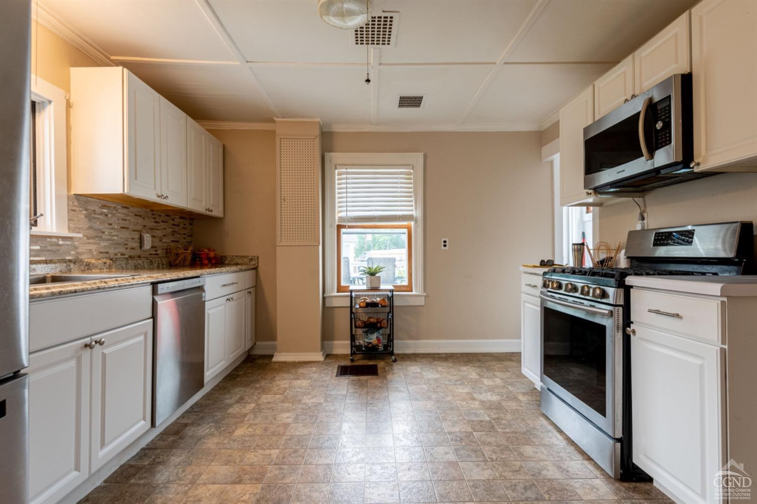5 Garage Place Road Ghent, NY 12075 - Photo 20 of 41 a kitchen with a stove a sink and a microwave