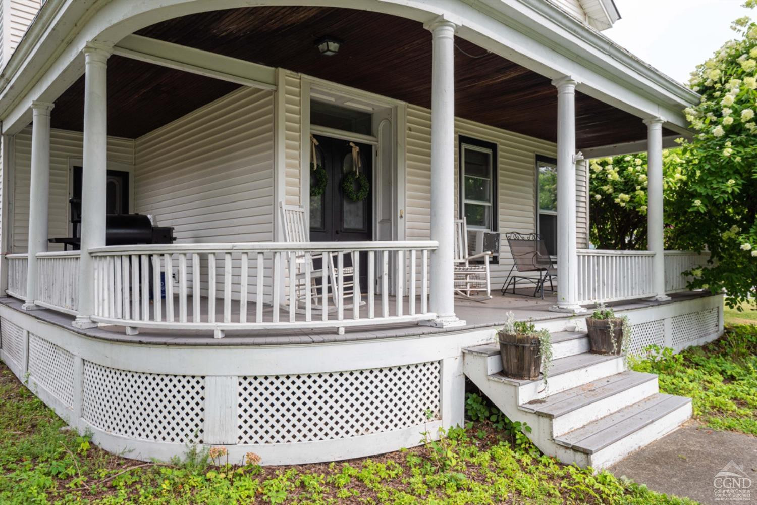 5 Garage Place Road Ghent, NY 12075 - Photo 4 of 41 a view of a chair and table in the patio