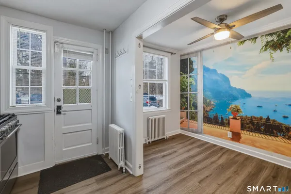 wooden floor in an empty room with a window