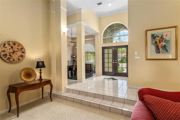 a view of a a dining room with furniture window and wooden floor