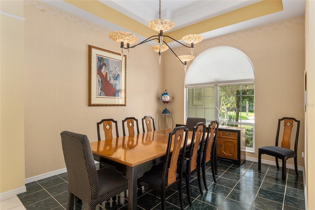 2215 Spring Hill Court Ocala, FL 34471 - Photo 13 of 62 a view of a dining room with furniture window and outside view