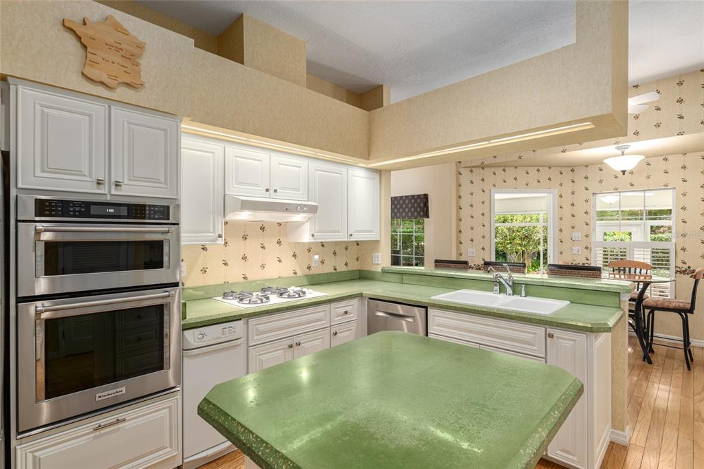 2215 Spring Hill Court Ocala, FL 34471 - Photo 16 of 62 a kitchen with stainless steel appliances granite countertop a stove a sink and a microwave