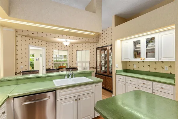 a large kitchen with a large window