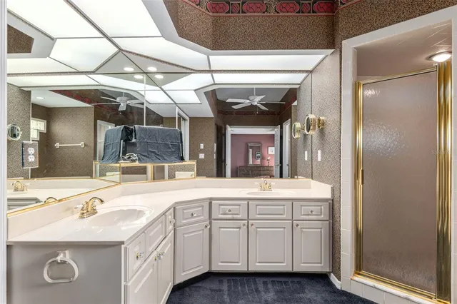 a bathroom with a shower and a glass door