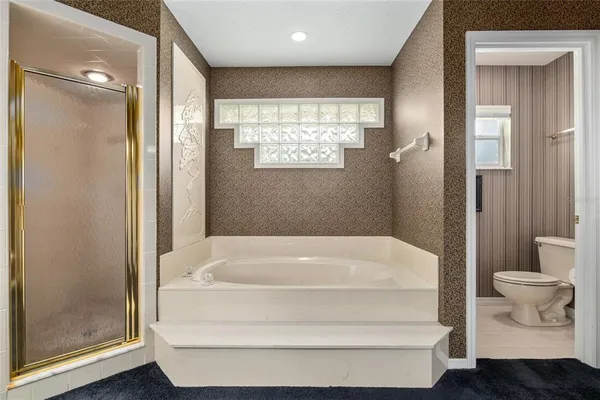 a bedroom with two beds and a window