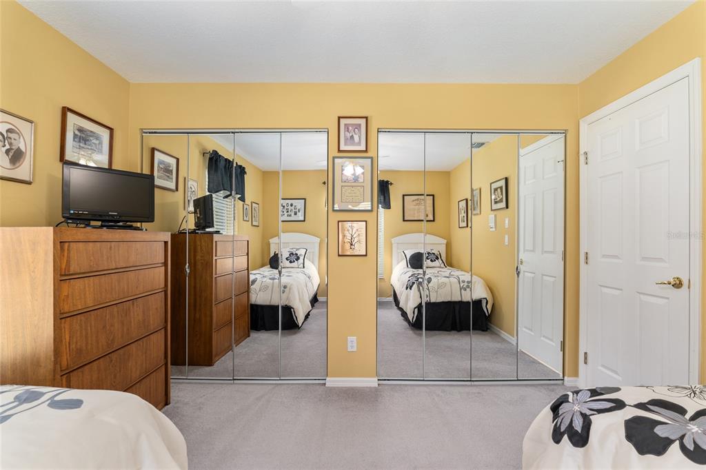 2215 Spring Hill Court Ocala, FL 34471 - Photo 37 of 62 a bedroom with a bed and a couch