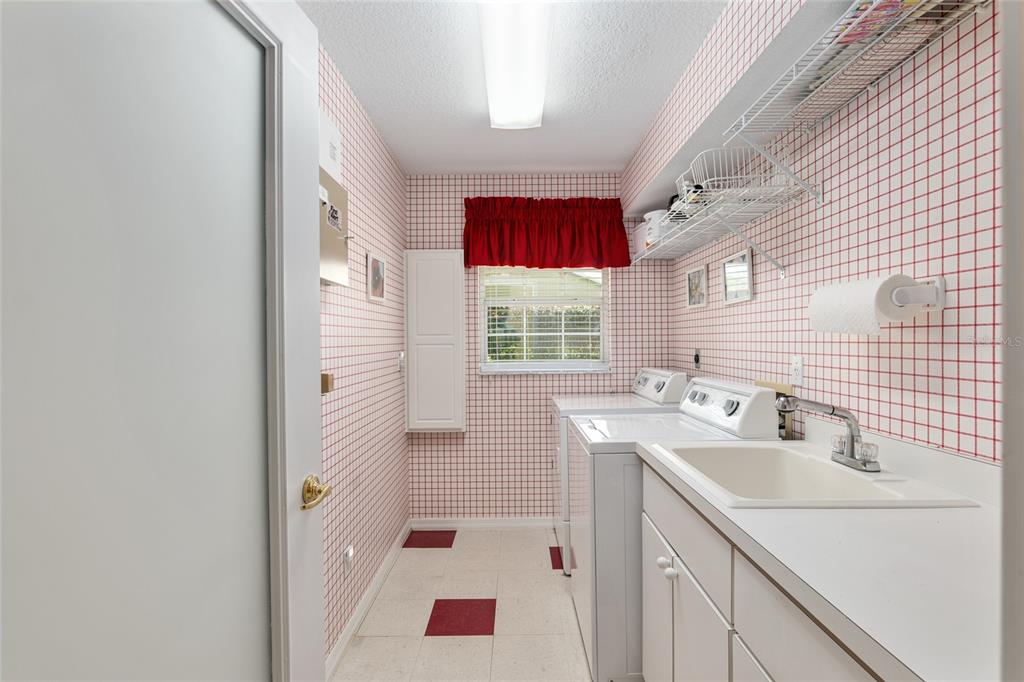 2215 Spring Hill Court Ocala, FL 34471 - Photo 39 of 62 a bathroom with a sink a toilet and shower