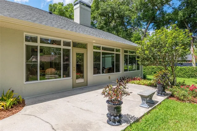 a view of a livingroom with a furniture ceiling fan