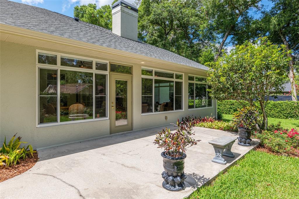 2215 Spring Hill Court Ocala, FL 34471 - Photo 48 of 62 a front view of a house with a garden