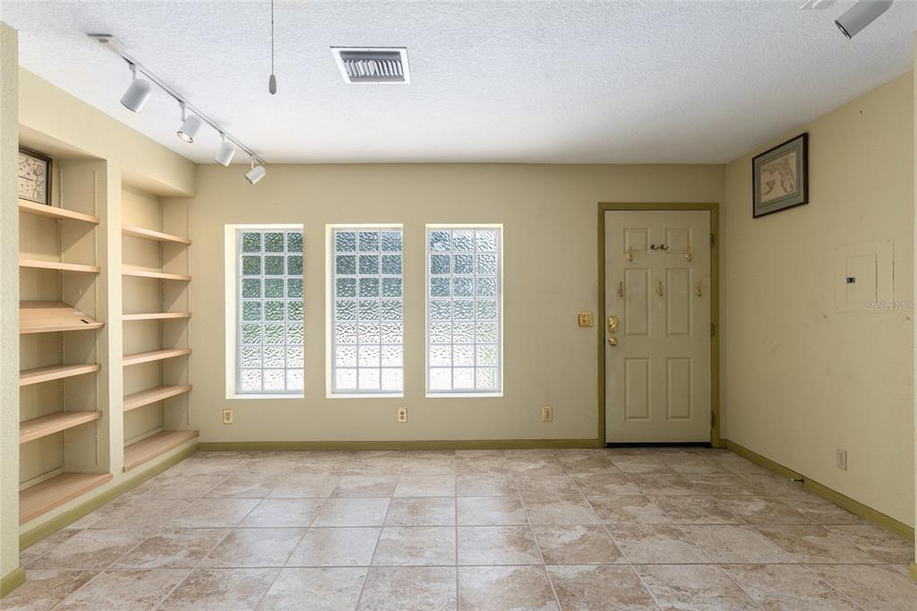 2215 Spring Hill Court Ocala, FL 34471 - Photo 58 of 62 a view of an empty room with a window and cabinet