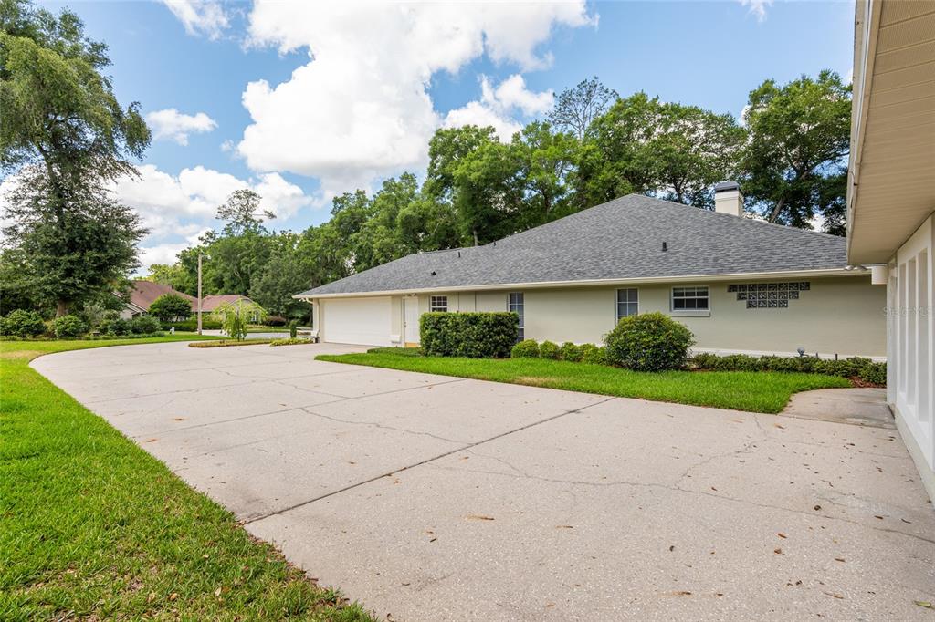 2215 Spring Hill Court Ocala, FL 34471 - Photo 62 of 62 a aerial view of a house next to a yard