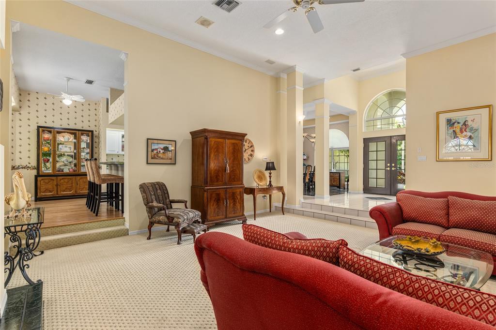 2215 Spring Hill Court Ocala, FL 34471 - Photo 10 of 62 a living room with furniture ceiling fan and a rug
