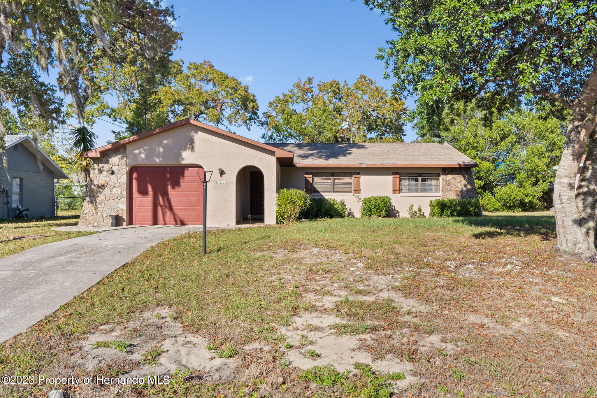 10479 Thornberry Drive Spring Hill, FL 34608 - Photo 2 of 44 a front view of a house with a yard