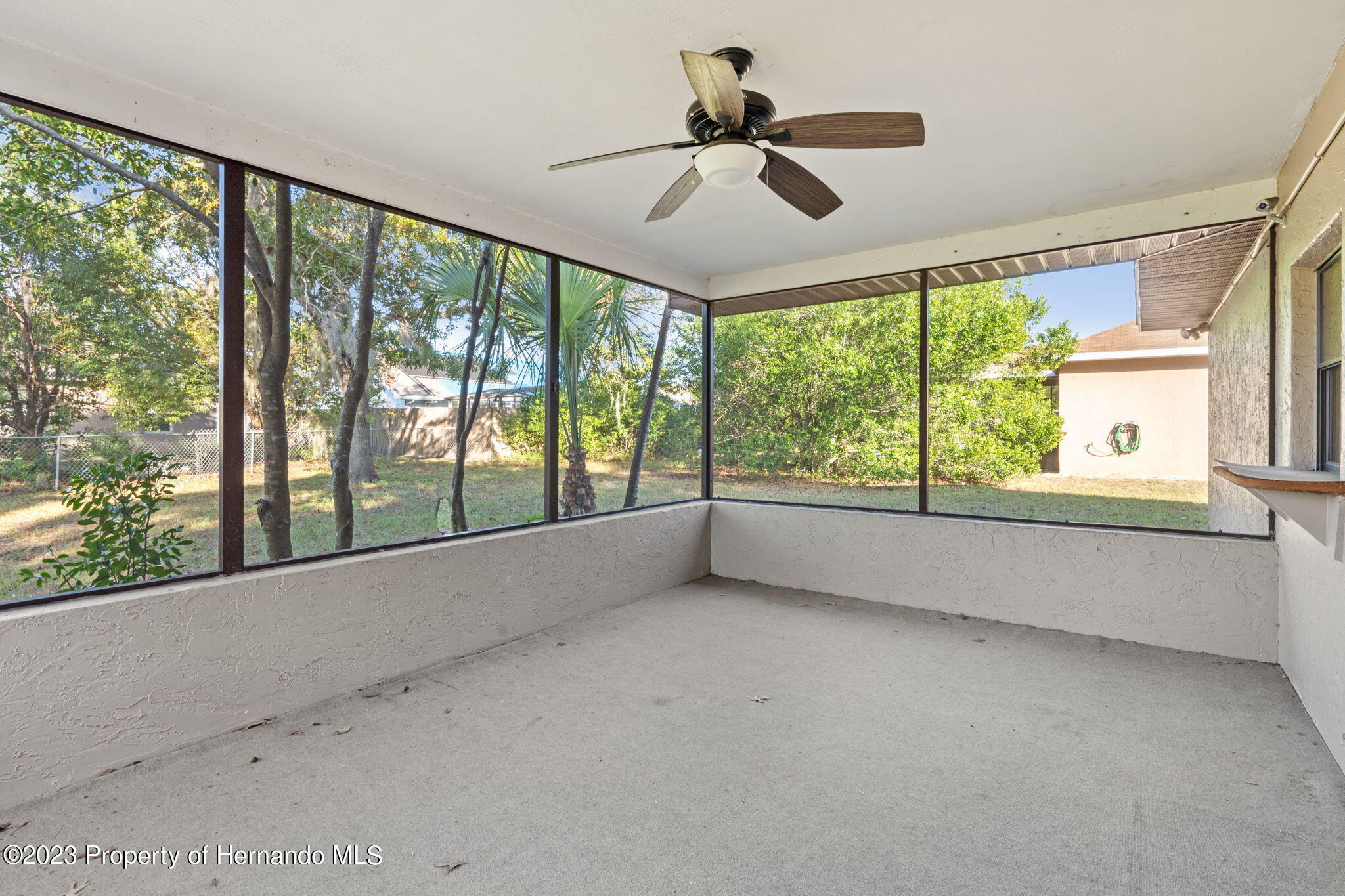 10479 Thornberry Drive Spring Hill, FL 34608 - Photo 27 of 44 a view of room with window and ceiling fan