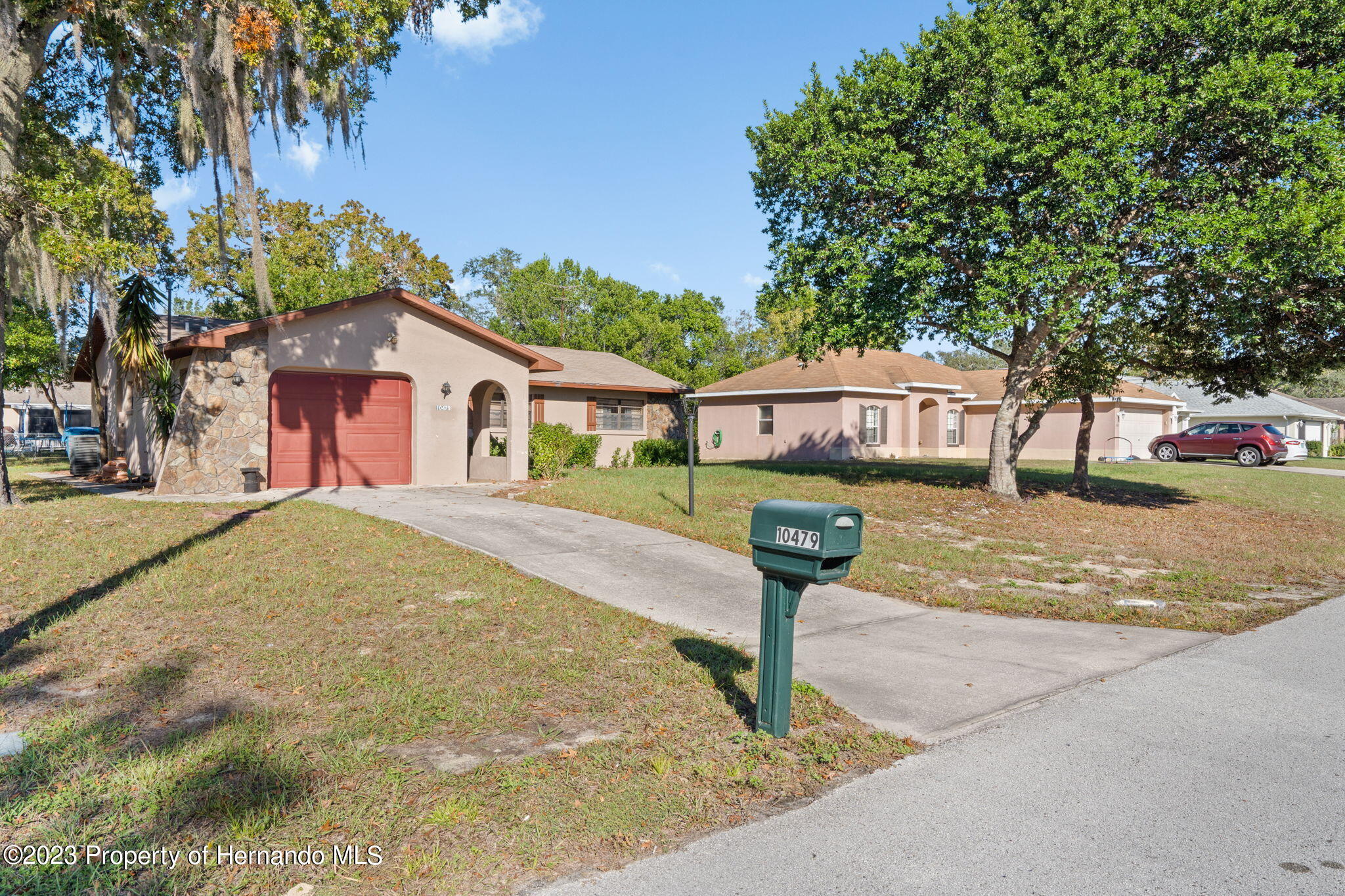 10479 Thornberry Drive Spring Hill, FL 34608 - Photo 3 of 44 a house view with garden space