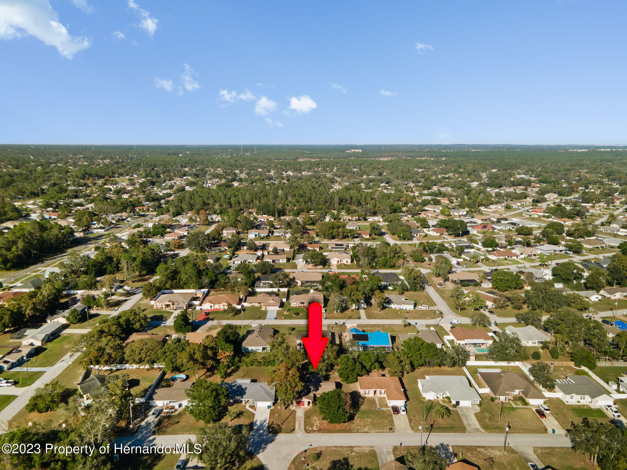 10479 Thornberry Drive Spring Hill, FL 34608 - Photo 33 of 44 an aerial view of residential houses with outdoor space and swimming pool