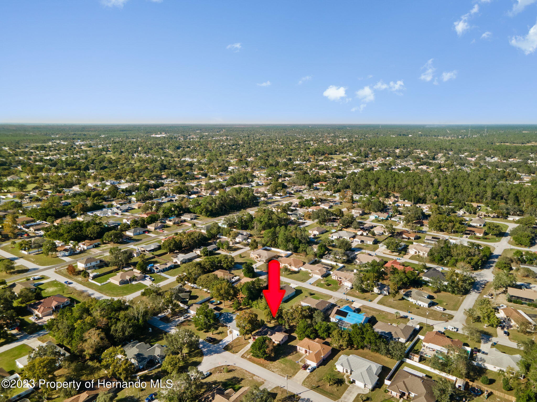 10479 Thornberry Drive Spring Hill, FL 34608 - Photo 34 of 44 an aerial view of residential houses with outdoor space and swimming pool