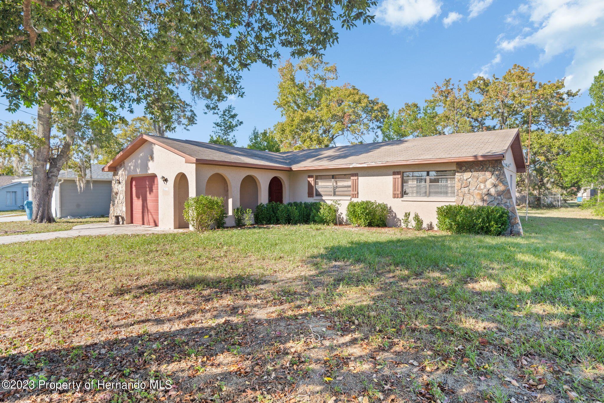 10479 Thornberry Drive Spring Hill, FL 34608 - Photo 6 of 44 a view of a house with yard and tree s