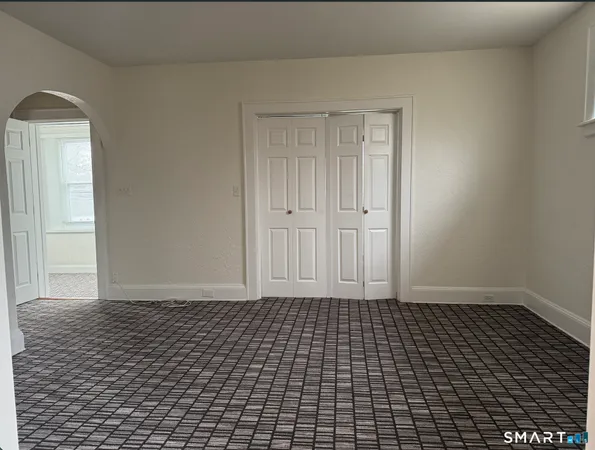 a view of a livingroom with wooden floor