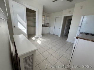 285 Clover Street, Unit 2 Stratford, CT 06614 - Photo 3 of 25 a view of an empty room with wooden floor and a window