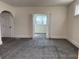 285 Clover Street, Unit 2 Stratford, CT 06614 - Photo 8 of 25 an empty room with window