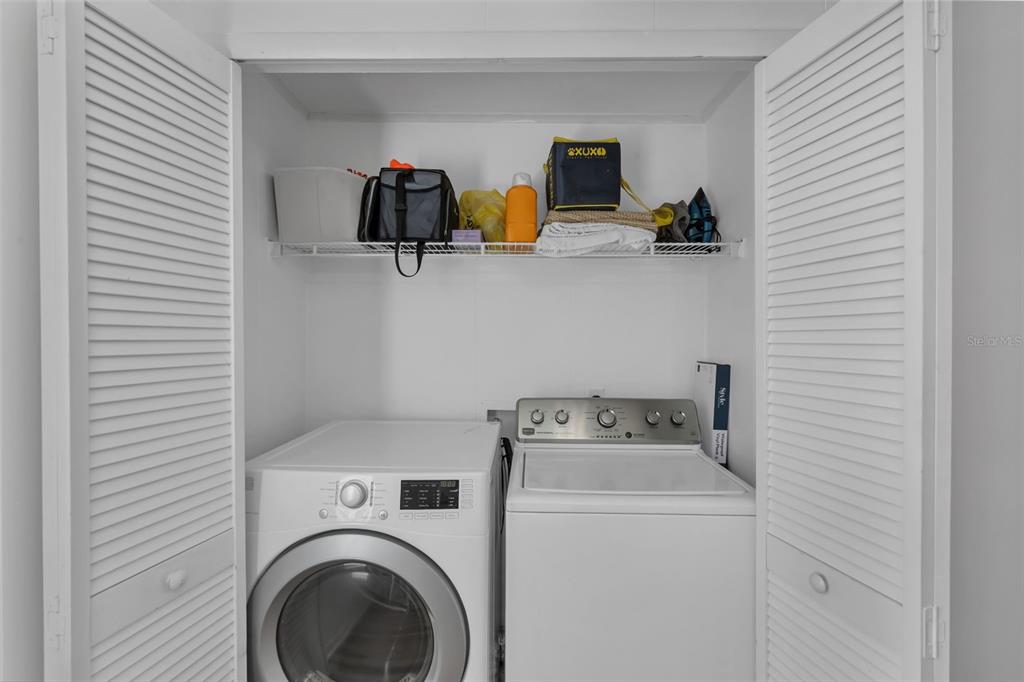 373 Eron Way, Unit 47 Winter Garden, FL 34787 - Photo 16 of 41 a utility room with dryer and washer