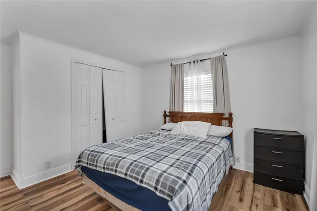 a bedroom with a bed and a dresser