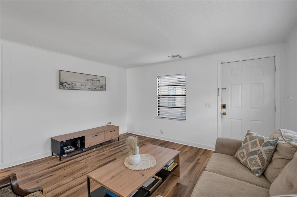 373 Eron Way, Unit 47 Winter Garden, FL 34787 - Photo 3 of 41 a living room with furniture and a window