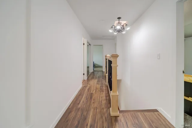 a bedroom with a bed and chair