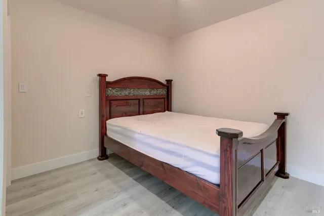 a bedroom with a bed and a dresser