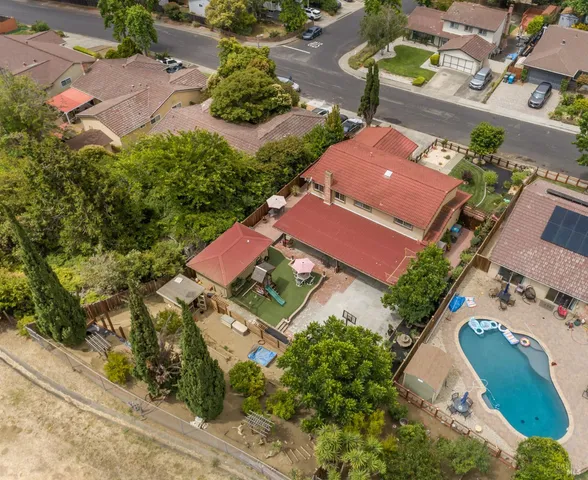 an aerial view of houses with yard