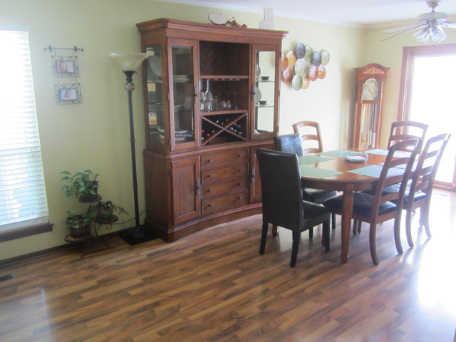 733 Rockhurst Road Bolingbrook, IL 60440 - Photo 3 of 20 a dining room with furniture and wooden floor