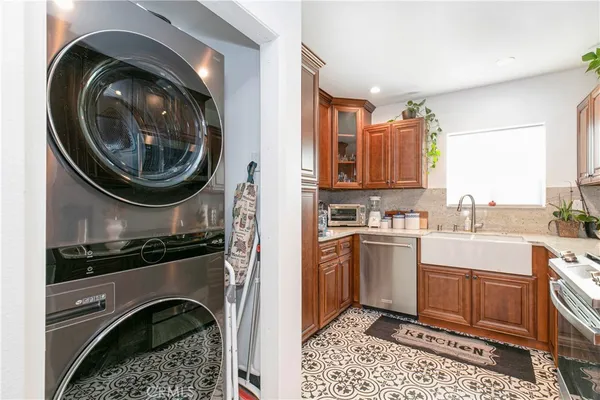 a kitchen with a stove a sink and a refrigerator