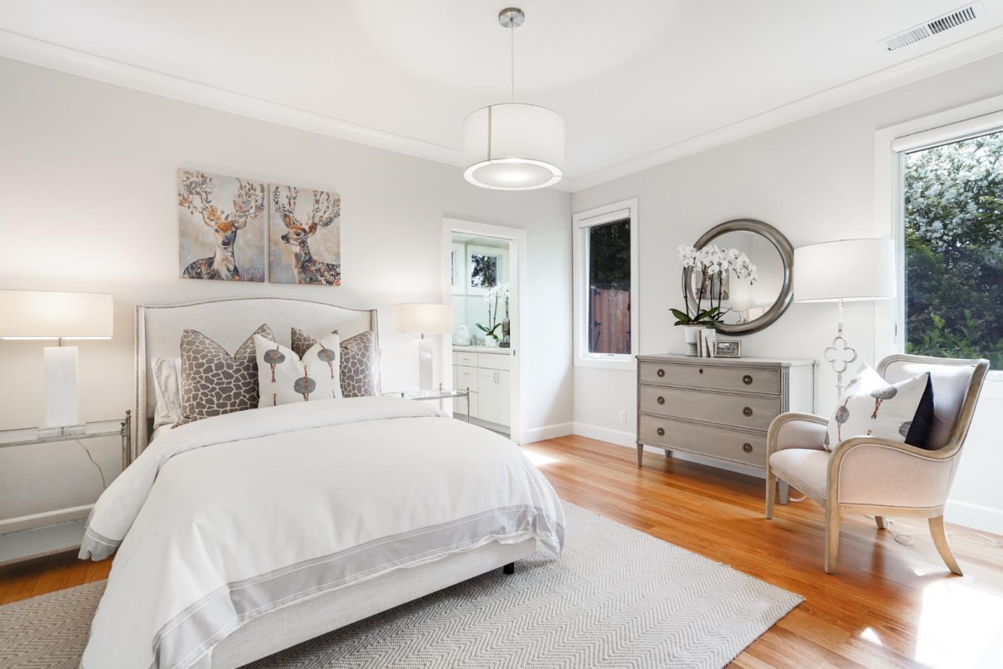 196 Merritt Road Los Altos, CA 94022 - Photo 26 of 46 a spacious bedroom with a bed a mirror and a large window