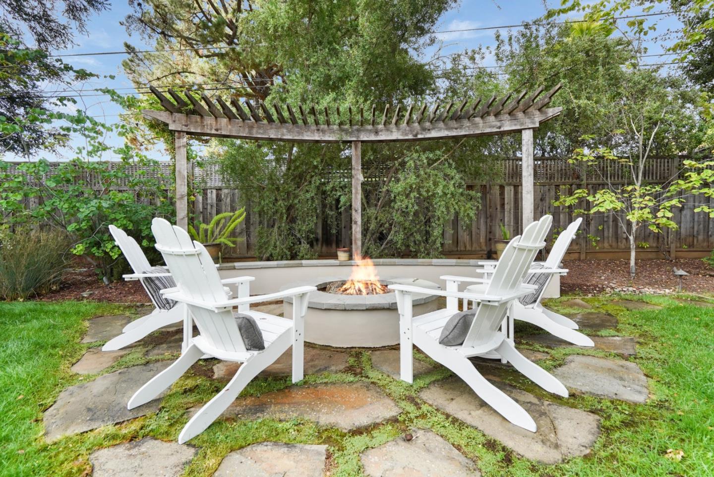 196 Merritt Road Los Altos, CA 94022 - Photo 38 of 46 a white bench sitting in the middle of a garden