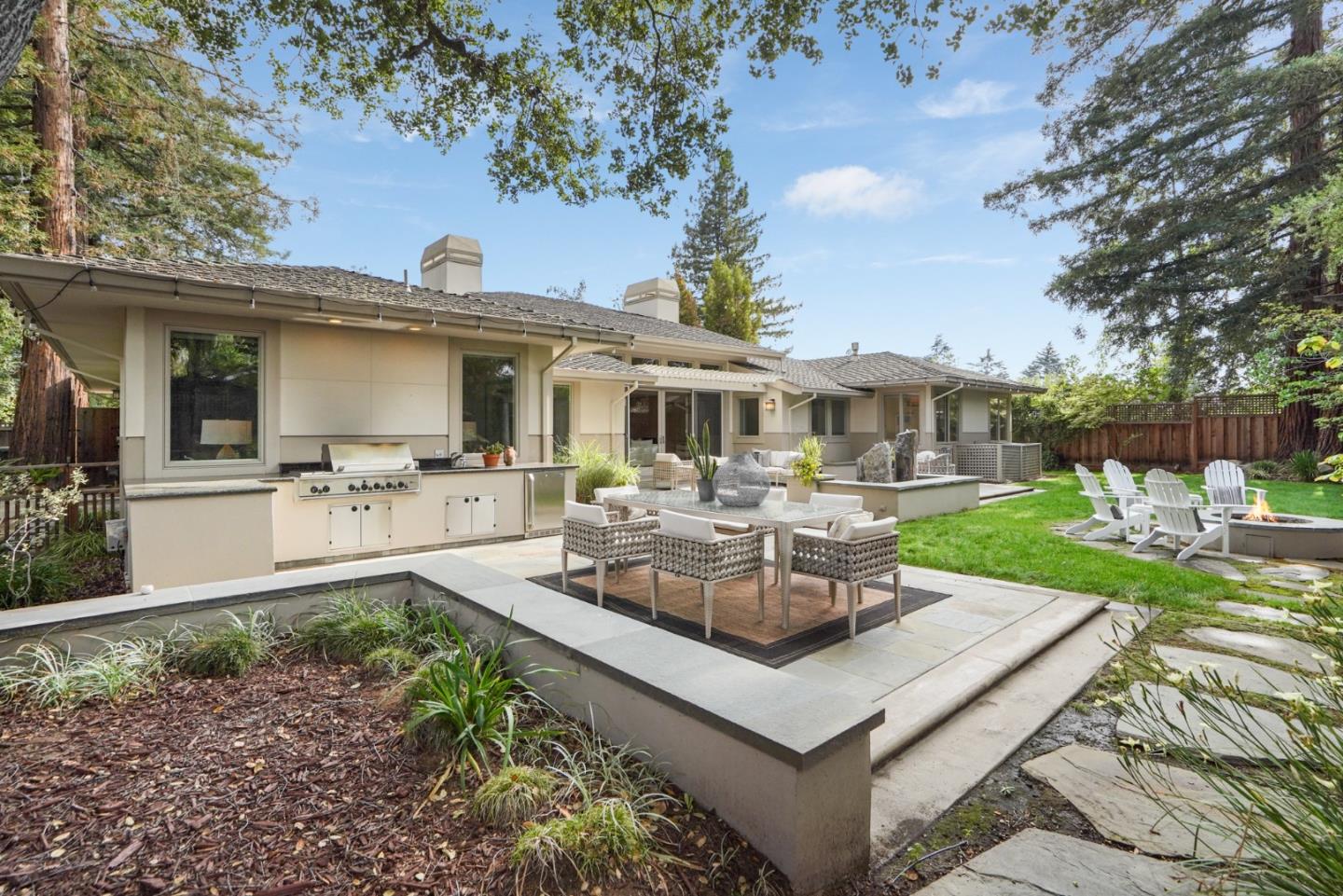 196 Merritt Road Los Altos, CA 94022 - Photo 40 of 46 a front view of a house with garden and sitting area